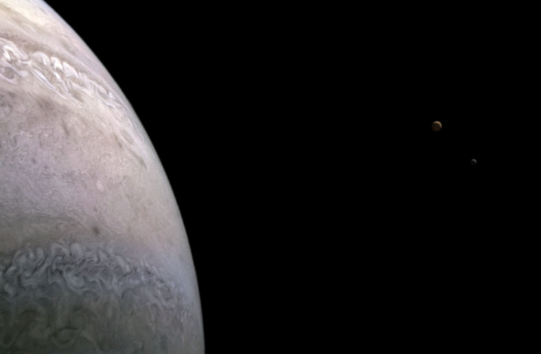 Jupiter (from left), Io, and Europa pictured from the Juno spacecraft 
