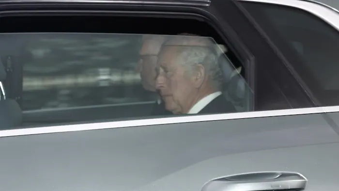 King Charles III was seen in the back of the car. 