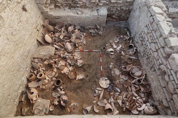 Warehouse full of dishes.  A chest containing 400 copper coins was also found